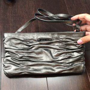 Lightly used silver MK clutch